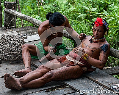 Men Mentawai tribe make tattoo. Editorial Stock Photo